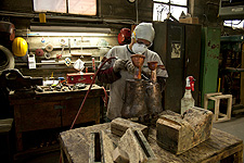 Chasing a bronze sculpture by Angel Botello.